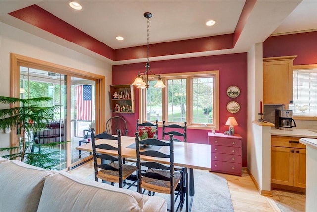 14 Wood Brook Way, Fitchburg, WI 53711 - dining area featuring light wood-type flooring, a chandelier, recessed lighting, and a raised ceiling