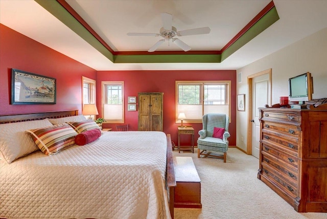 14 Wood Brook Way, Fitchburg, WI 53711 - bedroom featuring a tray ceiling, multiple windows, light carpet, ceiling fan, and crown molding