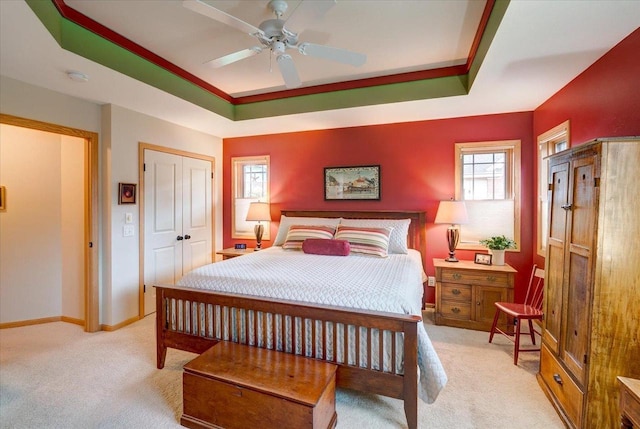 14 Wood Brook Way, Fitchburg, WI 53711 - bedroom featuring light colored carpet, a raised ceiling, a ceiling fan, and a closet