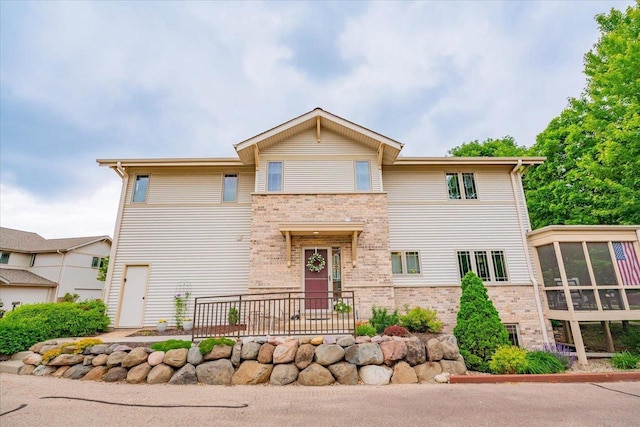 14 Wood Brook Way, Fitchburg, WI 53711 - view of front of property featuring brick siding and a sunroom