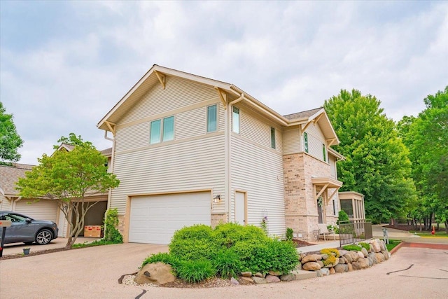 14 Wood Brook Way, Fitchburg, WI 53711 - view of side of property featuring an attached garage and driveway