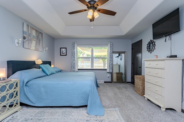 8810 Hinner Springs Dr, Weston, WI 54476 - carpeted bedroom with a tray ceiling and a ceiling fan