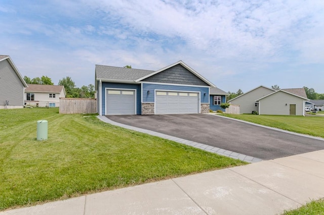 8810 Hinner Springs Dr, Weston, WI 54476 - view of front facade featuring stone siding, driveway, and a garage