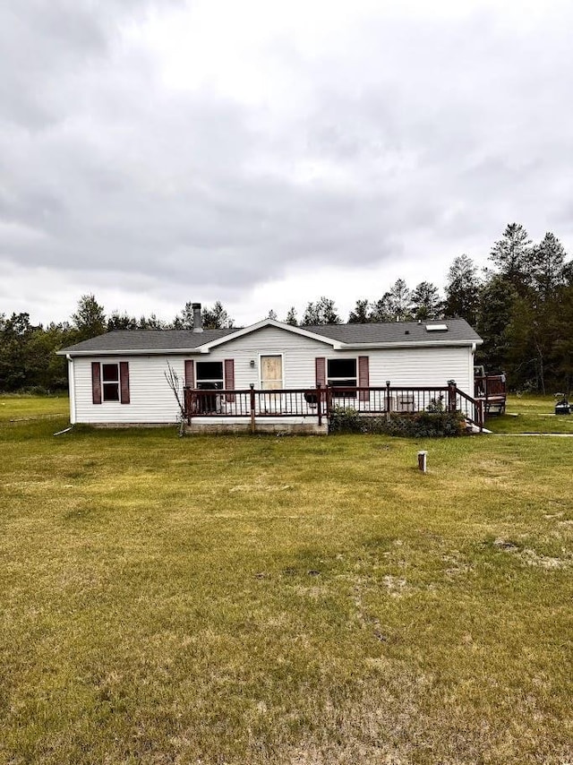 691 Valley Trl, Nekoosa, WI 54457 - rear view of house with a deck and a yard