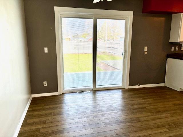 1710 N 25th St, Sheboygan, WI 53081 - unfurnished dining area featuring dark wood-style floors