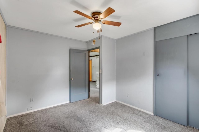 226 Winnebago Ave, Portage, WI 53901 - unfurnished bedroom with carpet flooring, a ceiling fan, and a closet
