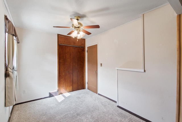 226 Winnebago Ave, Portage, WI 53901 - unfurnished bedroom featuring carpet flooring, a closet, and a ceiling fan