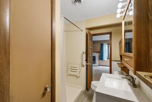 226 Winnebago Ave, Portage, WI 53901 - full bathroom with a shower stall, vanity, and wood finished floors