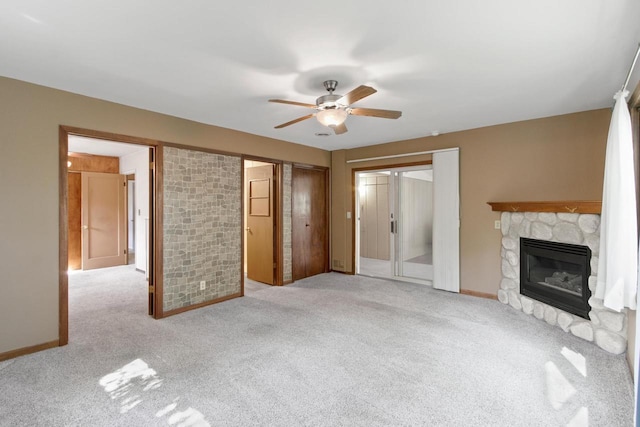 226 Winnebago Ave, Portage, WI 53901 - unfurnished living room with a fireplace, carpet floors, and a ceiling fan