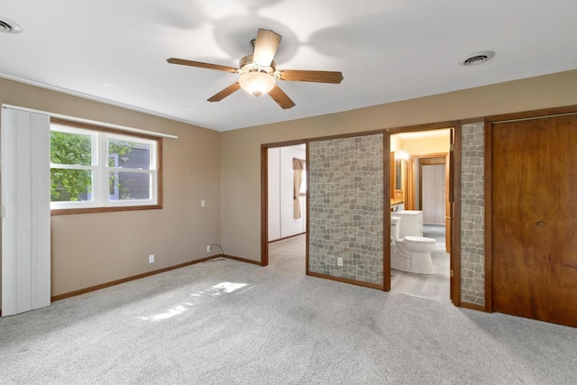 226 Winnebago Ave, Portage, WI 53901 - unfurnished bedroom featuring carpet, ensuite bath, and a ceiling fan
