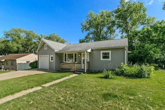 226 Winnebago Ave, Portage, WI 53901 - view of front of home with a garage, concrete driveway, a front yard, and a shingled roof