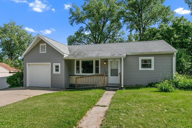 226 Winnebago Ave, Portage, WI 53901 - view of front of house with an attached garage, a front yard, driveway, and a shingled roof