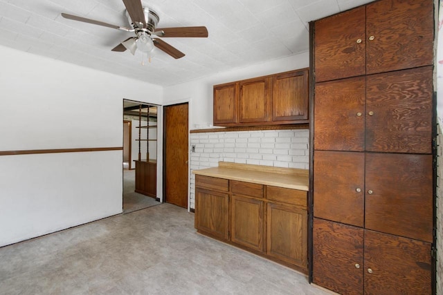 226 Winnebago Ave, Portage, WI 53901 - kitchen featuring brown cabinets, ceiling fan, and light countertops
