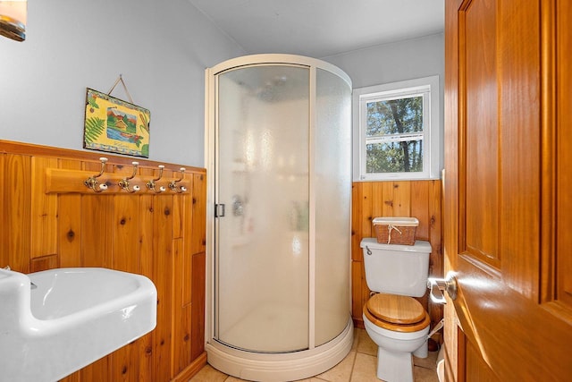 N11134 Nelson Rd, Athelstane, WI 54104 - bathroom with a shower stall, wooden walls, tile patterned floors, and wainscoting
