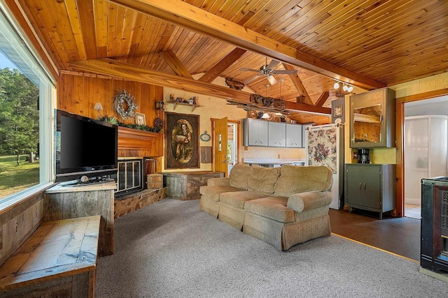 N11134 Nelson Rd, Athelstane, WI 54104 - living room featuring healthy amount of natural light, wooden ceiling, wood walls, dark colored carpet, and a ceiling fan
