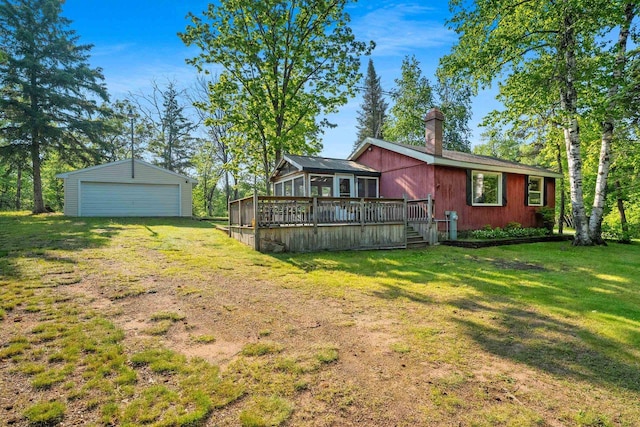 N11134 Nelson Rd, Athelstane, WI 54104 - back of house with a wooden deck, a garage, a lawn, and an outbuilding
