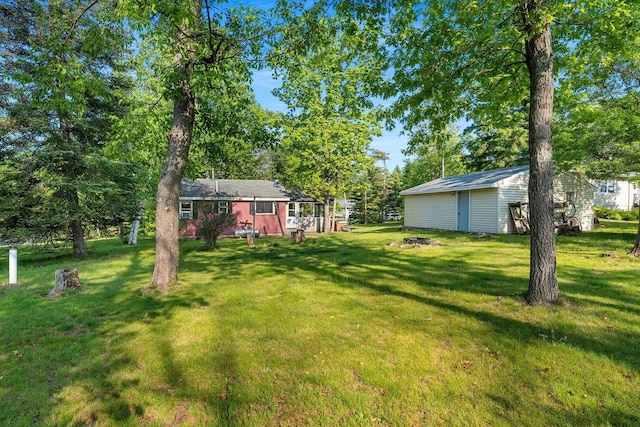 N11134 Nelson Rd, Athelstane, WI 54104 - view of green lawn featuring an outbuilding