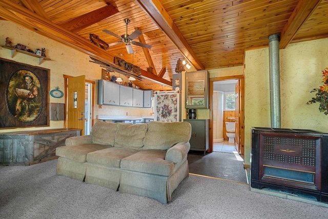N11134 Nelson Rd, Athelstane, WI 54104 - living area with a wood stove, a wood ceiling with exposed beams, light carpet, and ceiling fan