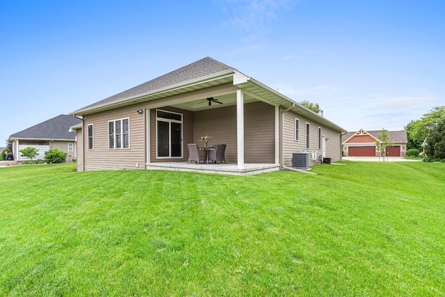 6600 N Kurey Dr, Appleton, WI 54913 - back of house with ceiling fan, a lawn, and a patio area