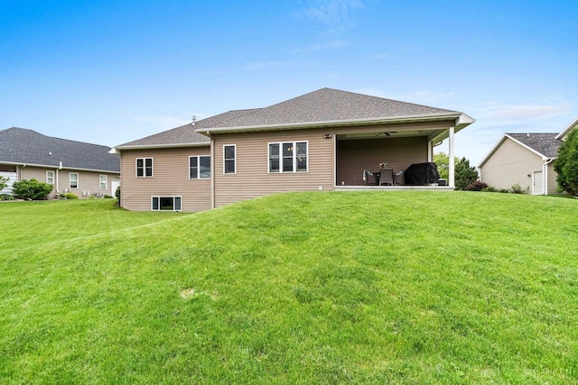 6600 N Kurey Dr, Appleton, WI 54913 - back of house featuring a yard and a patio area