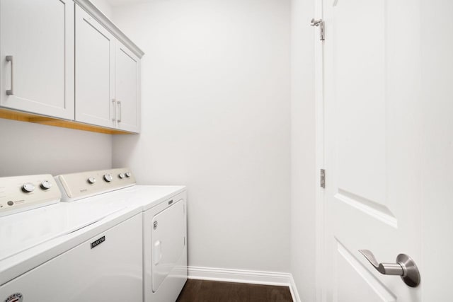 2701 Esker Dr, West Bend, WI 53095 - laundry area with separate washer and dryer, cabinet space, and dark wood finished floors