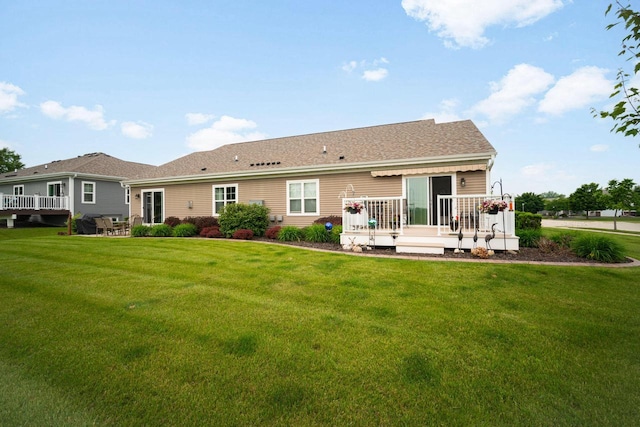 2701 Esker Dr, West Bend, WI 53095 - rear view of property featuring a deck and a yard