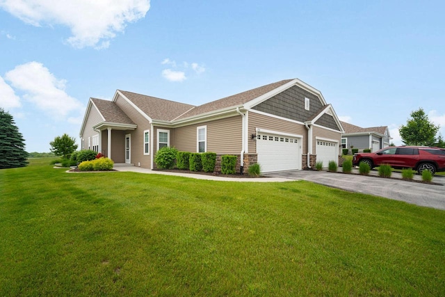 2701 Esker Dr, West Bend, WI 53095 - view of front of home with an attached garage, a front lawn, and driveway