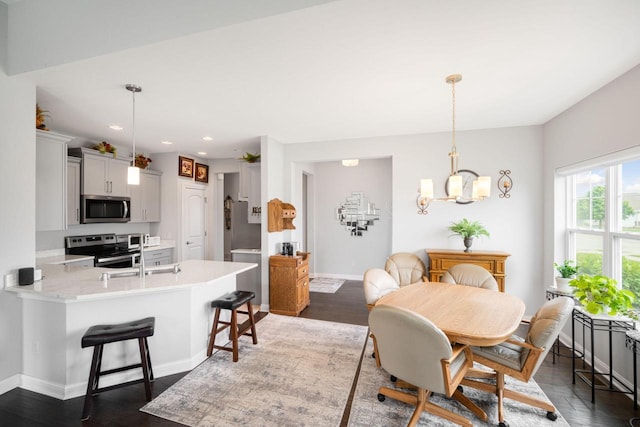 2701 Esker Dr, West Bend, WI 53095 - dining room featuring recessed lighting, dark wood-style flooring, and a chandelier