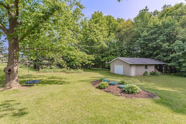 1340 Deer Brook Ct, Wausau, WI 54401 - view of grassy yard with a garage and an outbuilding