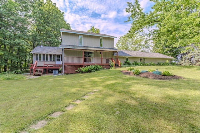 1340 Deer Brook Ct, Wausau, WI 54401 - back of property featuring a lawn and a sunroom