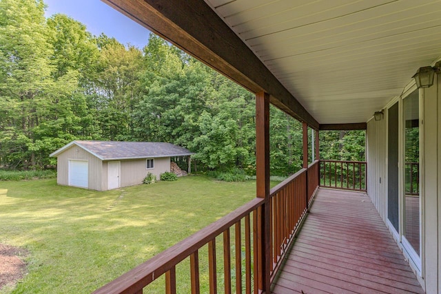 1340 Deer Brook Ct, Wausau, WI 54401 - wooden terrace with an outbuilding, a yard, a wooded view, and a detached garage