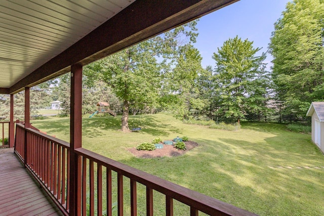 1340 Deer Brook Ct, Wausau, WI 54401 - wooden terrace featuring a playground, a yard, and view of scattered trees