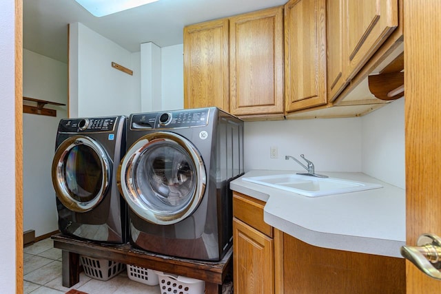 1340 Deer Brook Ct, Wausau, WI 54401 - laundry room with cabinet space, independent washer and dryer, and light tile patterned floors