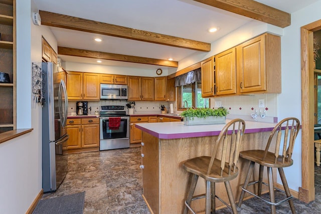 1340 Deer Brook Ct, Wausau, WI 54401 - kitchen featuring appliances with stainless steel finishes, a peninsula, tasteful backsplash, beam ceiling, and light countertops