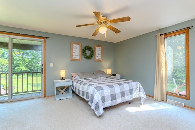 1340 Deer Brook Ct, Wausau, WI 54401 - bedroom featuring access to outside, multiple windows, light colored carpet, and ceiling fan