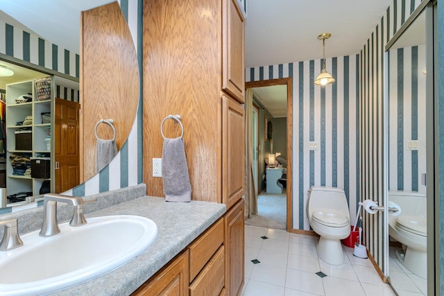 1340 Deer Brook Ct, Wausau, WI 54401 - bathroom featuring wallpapered walls, tile patterned floors, and vanity