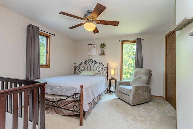 1340 Deer Brook Ct, Wausau, WI 54401 - bedroom featuring multiple windows, light carpet, and ceiling fan