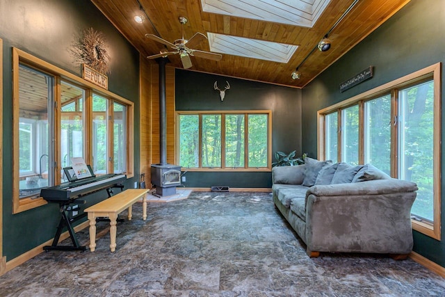 1340 Deer Brook Ct, Wausau, WI 54401 - living room with wooden ceiling, a wood stove, a ceiling fan, a skylight, and high vaulted ceiling