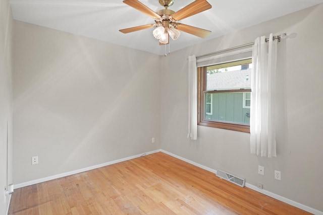 8074 48th Ave, Kenosha, WI 53142 - unfurnished room featuring wood finished floors and a ceiling fan