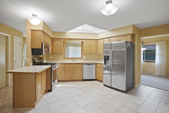 8074 48th Ave, Kenosha, WI 53142 - kitchen featuring stainless steel appliances, light countertops, light tile patterned flooring, and light brown cabinetry