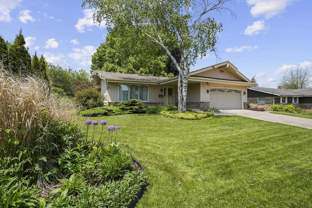 8074 48th Ave, Kenosha, WI 53142 - single story home with concrete driveway, an attached garage, stone siding, and a front yard