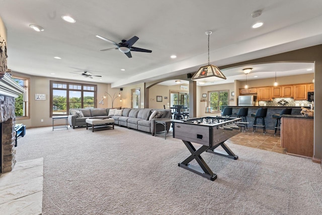 6507 Willow Ct, Waterford, WI 53185 - rec room featuring arched walkways, light colored carpet, recessed lighting, and a ceiling fan