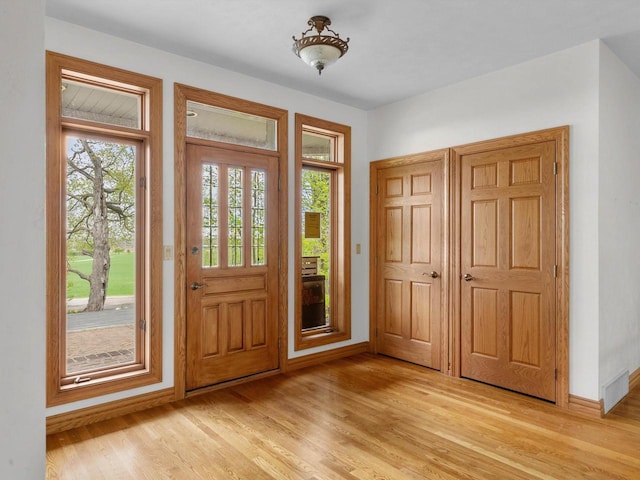 4228 County Hwy W, Valders, WI 54245 - entrance foyer featuring baseboards and light wood-style flooring