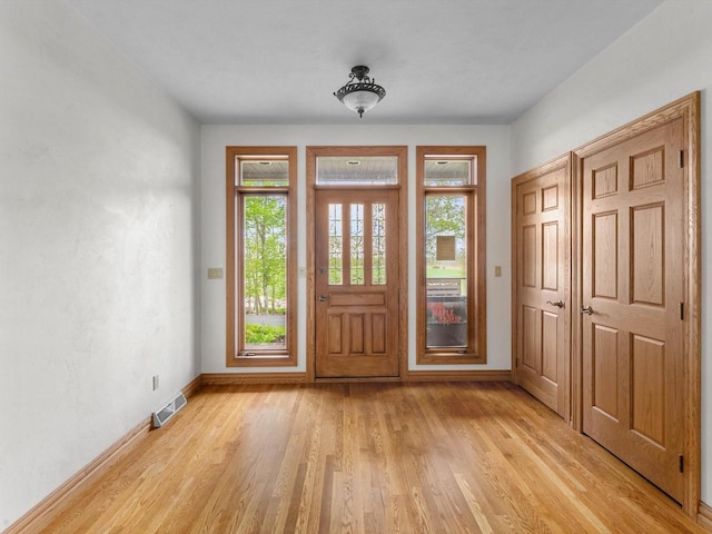 4228 County Hwy W, Valders, WI 54245 - foyer entrance with plenty of natural light and light wood-style floors
