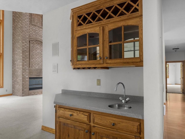 4228 County Hwy W, Valders, WI 54245 - bar featuring carpet floors and a fireplace