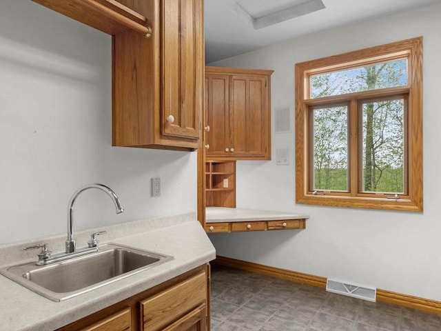 4228 County Hwy W, Valders, WI 54245 - kitchen with light countertops and brown cabinetry
