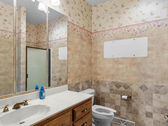 4228 County Hwy W, Valders, WI 54245 - bathroom with tile walls, vanity, a shower, and wallpapered walls