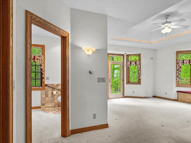 4228 County Hwy W, Valders, WI 54245 - empty room with carpet, ceiling fan, and a tray ceiling