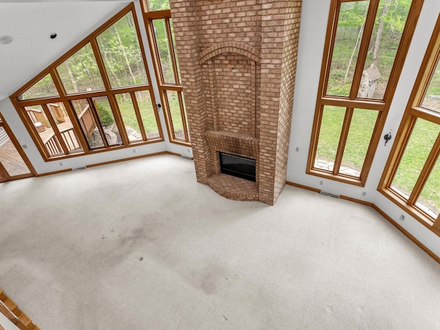 4228 County Hwy W, Valders, WI 54245 - unfurnished living room with carpet floors and a fireplace