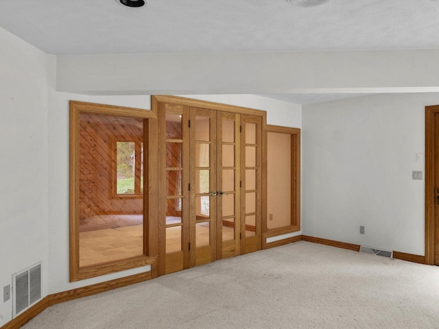 4228 County Hwy W, Valders, WI 54245 - unfurnished room featuring french doors and carpet